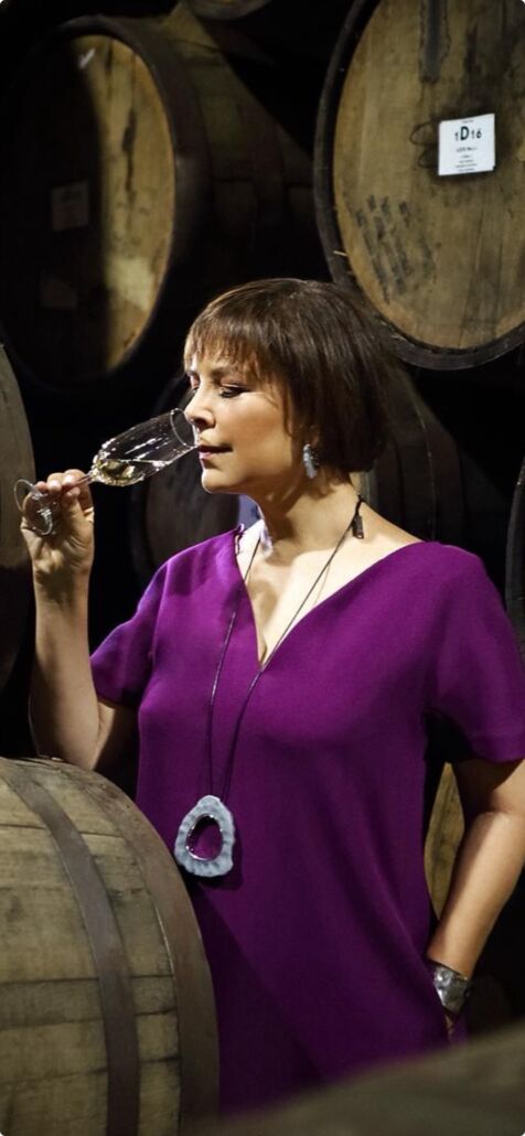 Ana Maria Romero Mena drinking a glass of Tequila